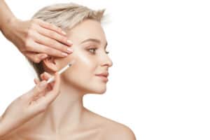 People, Lips, cosmetology, plastic surgery and beauty concept – beautiful young woman face